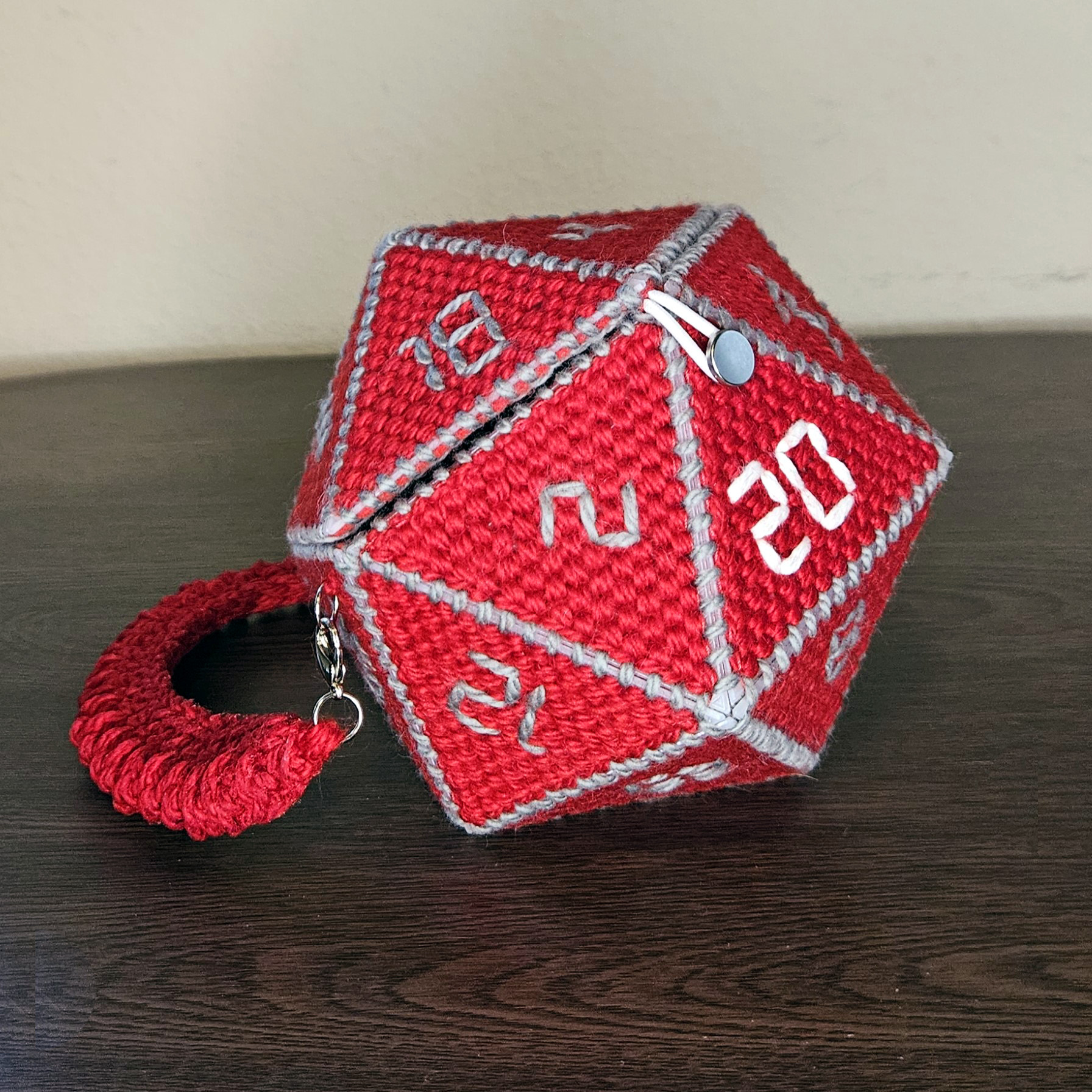 Red needlepoint D20 clutch with gray edging