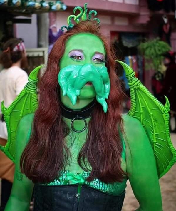 Green eldritch costume with tentacle face piece and wings