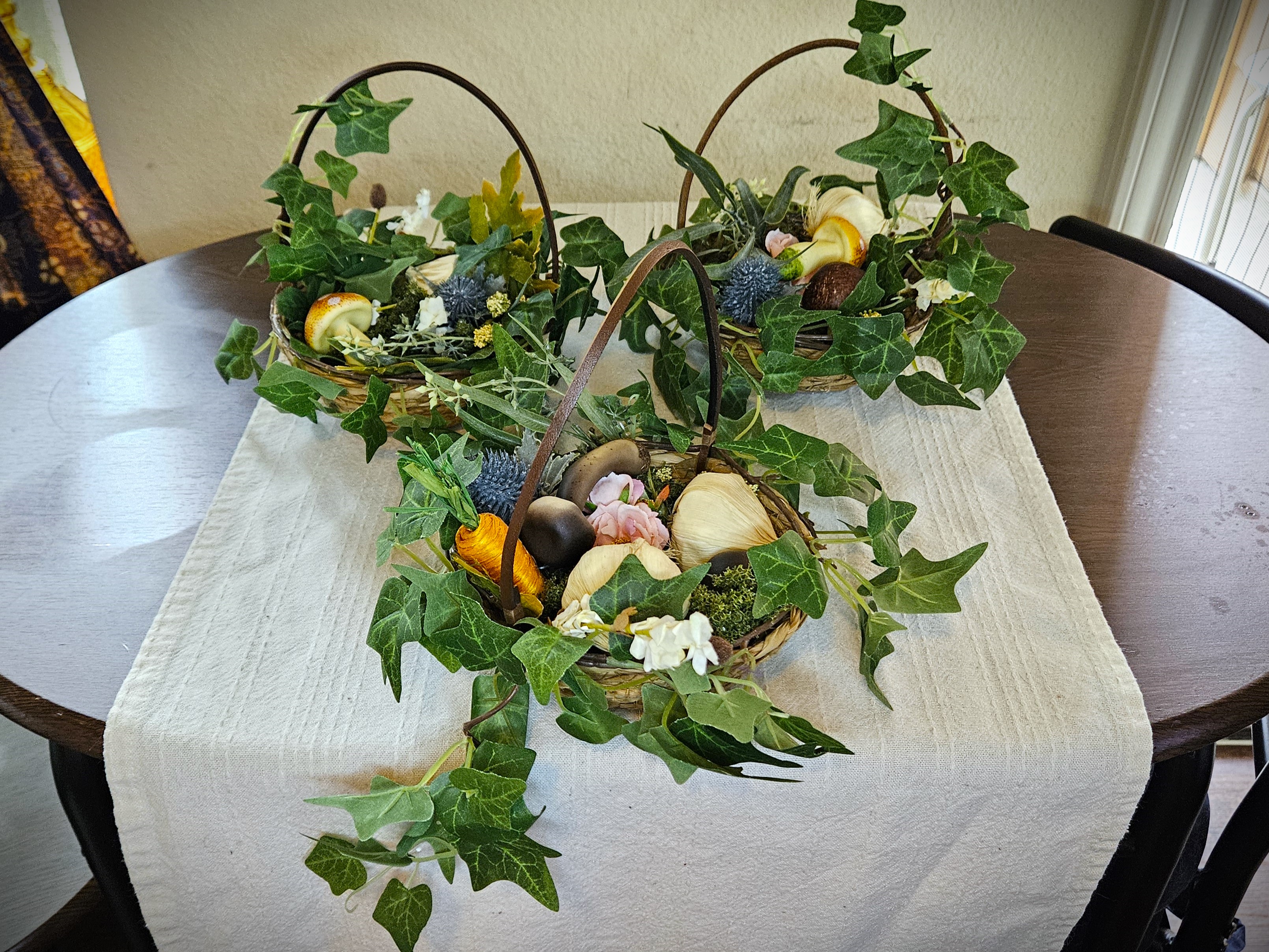 Three Halfling Handbaskets arranged on a table